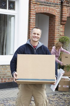 Man with a van loading household items near Highbury streets